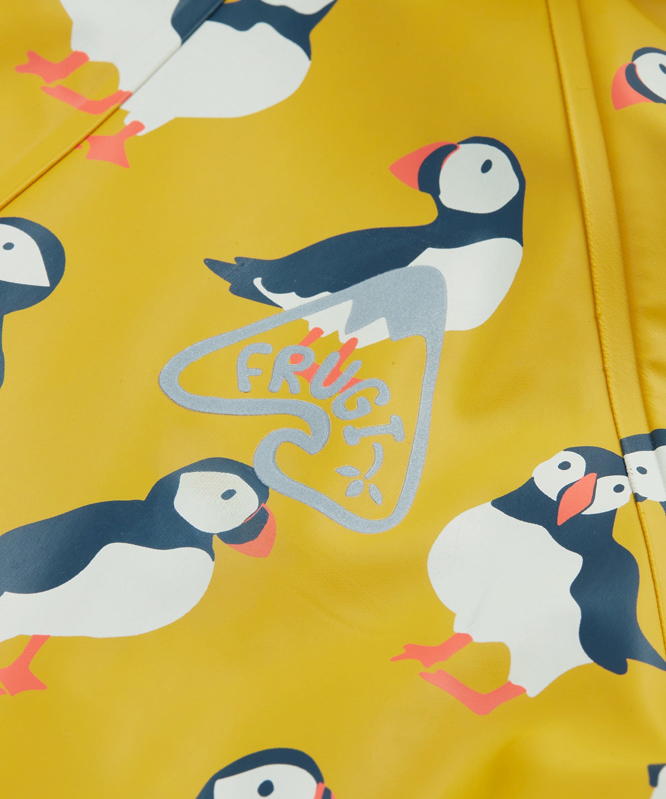 Frugi kids puddle buster jacket yellow with a puffin design print detail