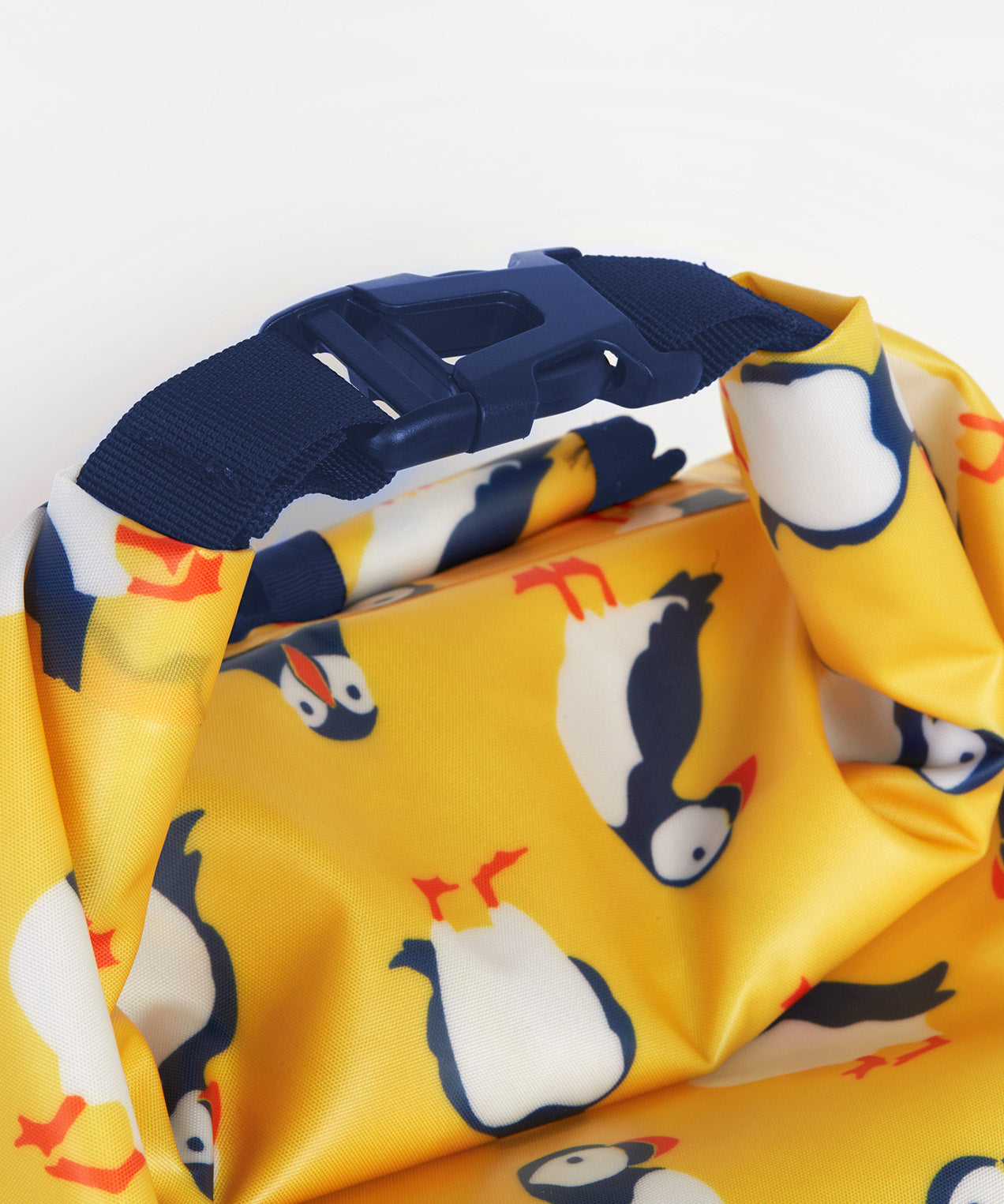 Frugi yellow dry bag puffin design top clip detail