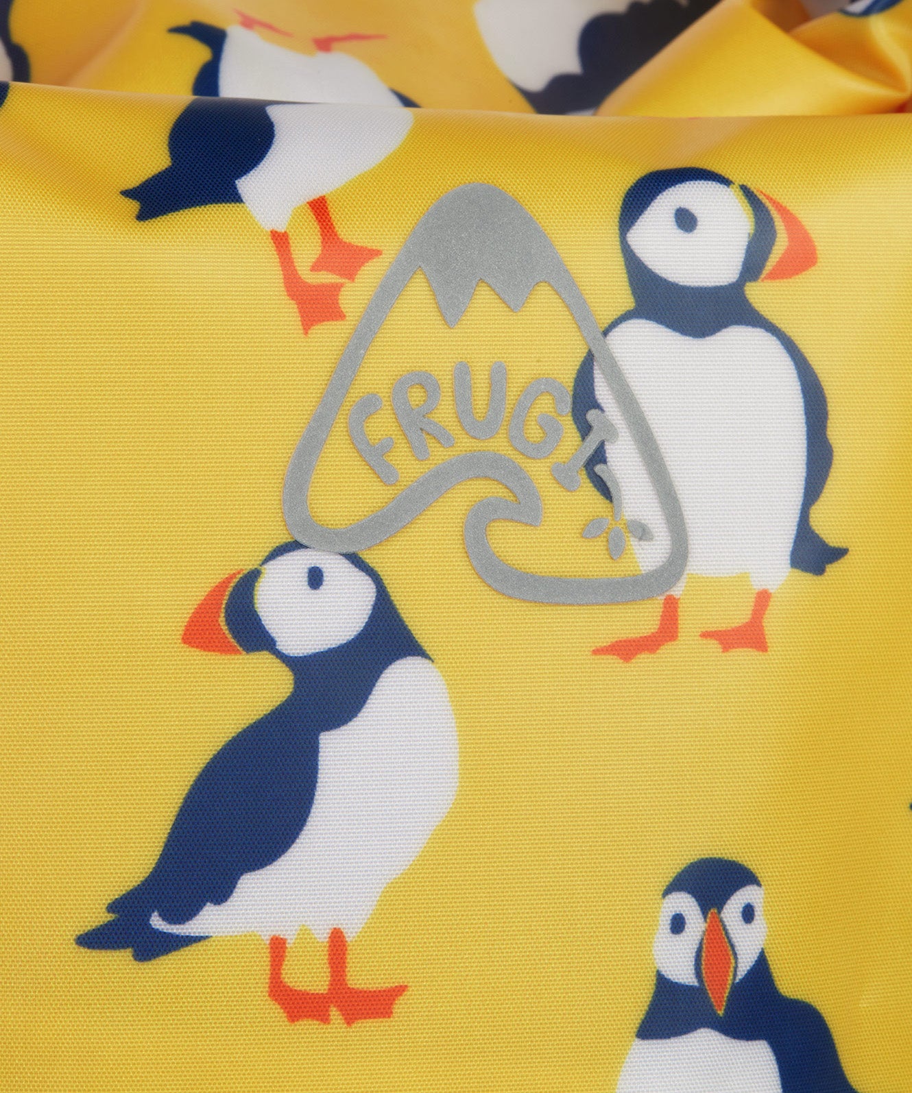 Frugi yellow dry bag puffin design print detail