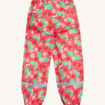 Frugi pink rain shine trousers strawberries design back detail on a cream background.