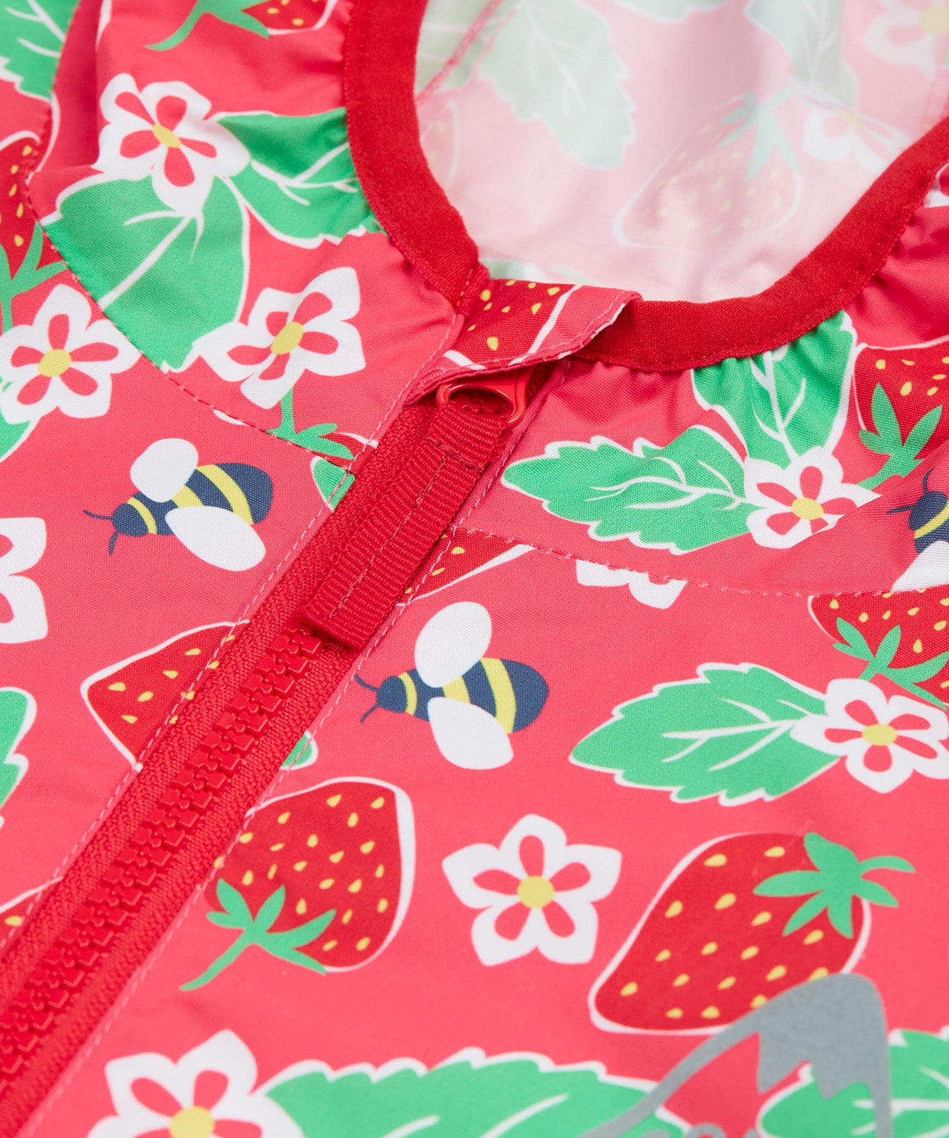 Frugi pink rain jacket strawberry pals zip detail.