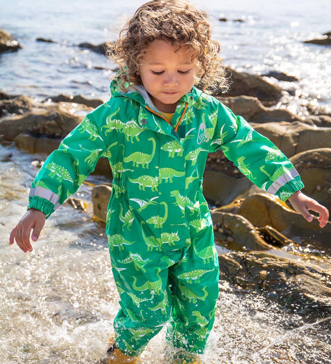 Frugi green all in one suit dino roar design