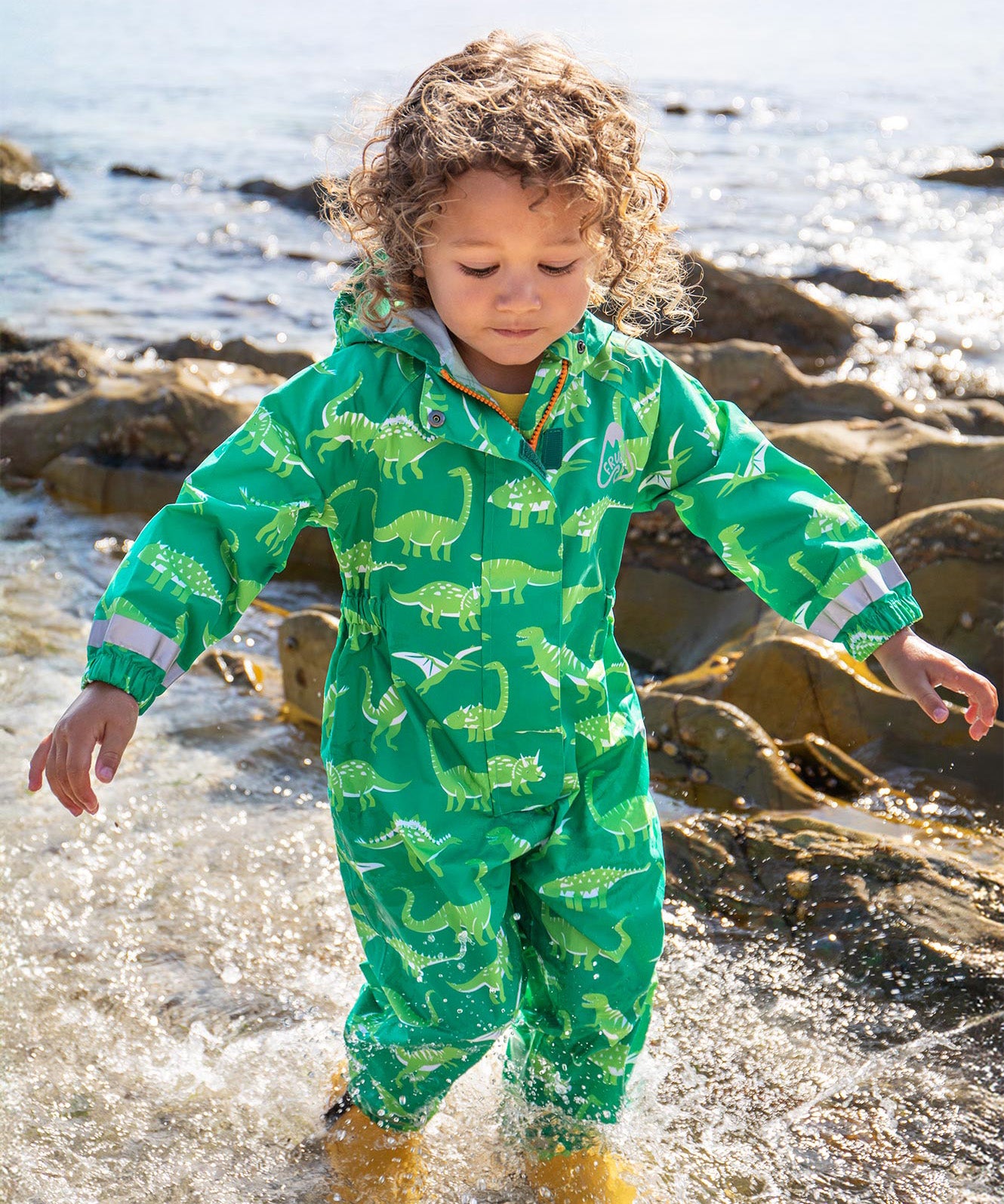 Frugi green all in one suit dino roar design