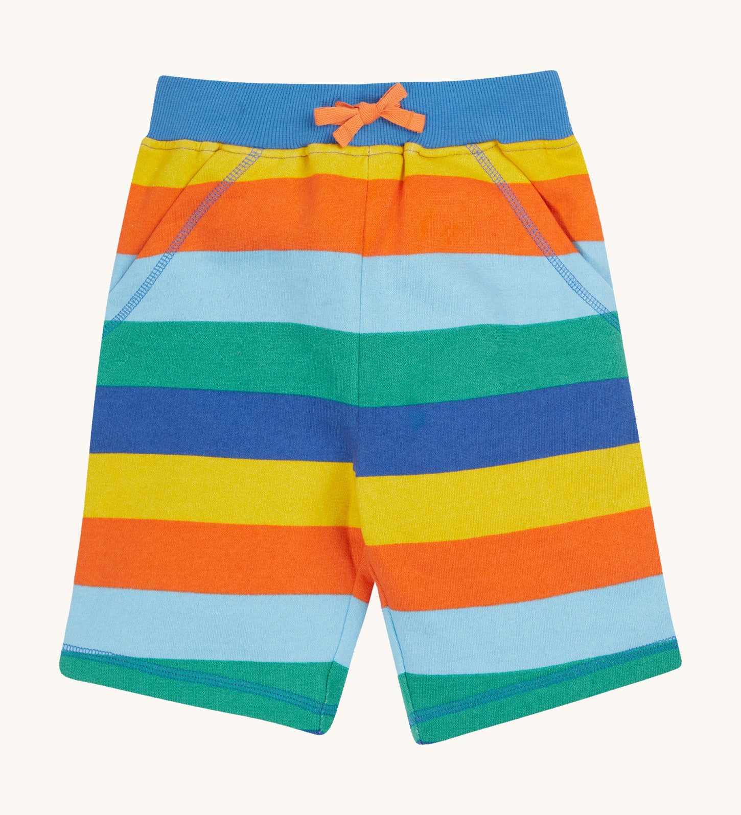 Frugi rainbow coloured bold stripes shorts on a cream background.