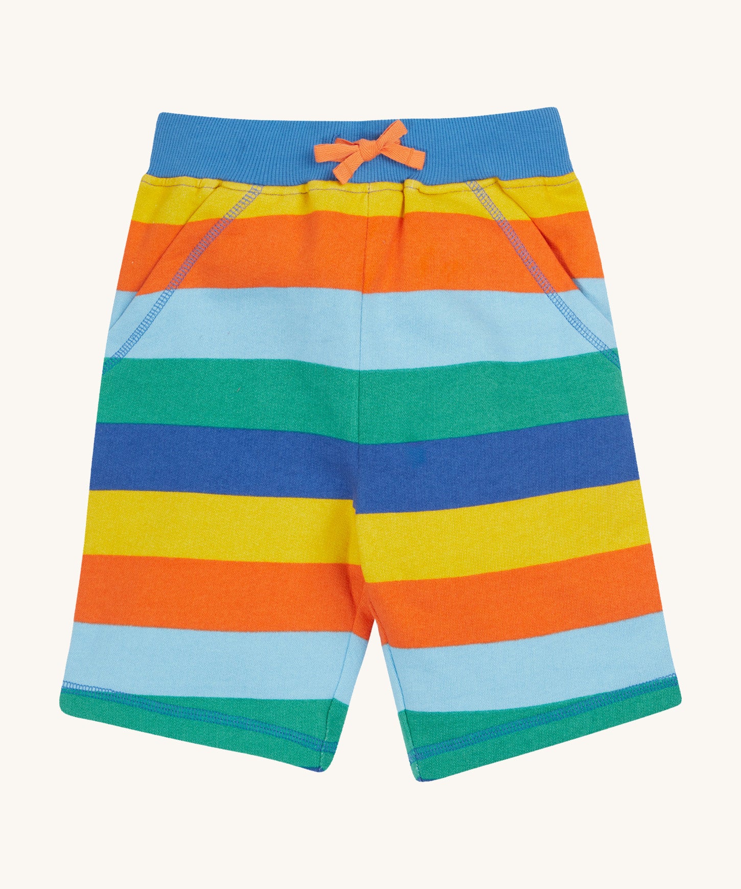 Frugi rainbow coloured bold stripes shorts on a cream background.