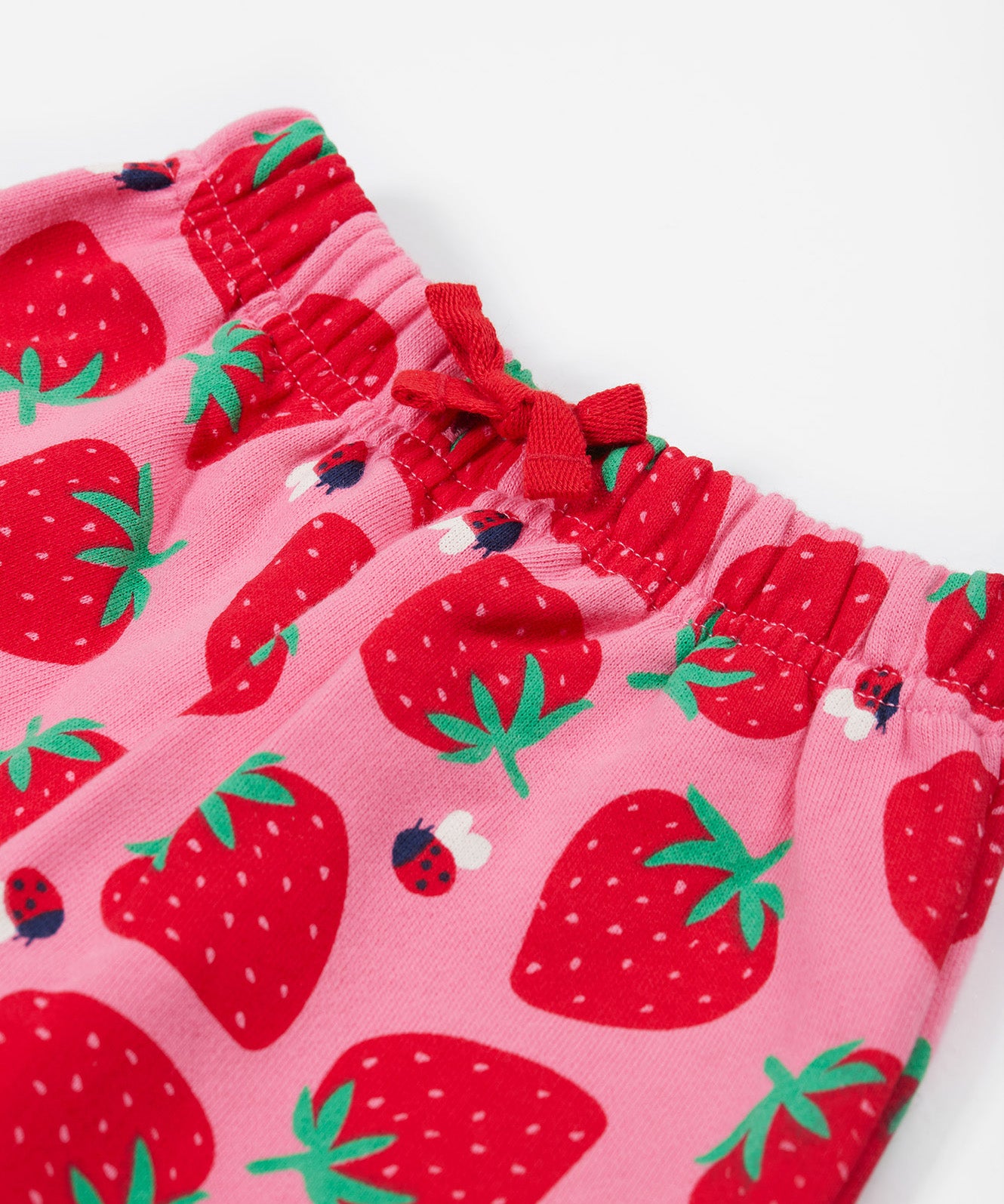 Frugi pink snuggle crawlers strawberry pals waist detail