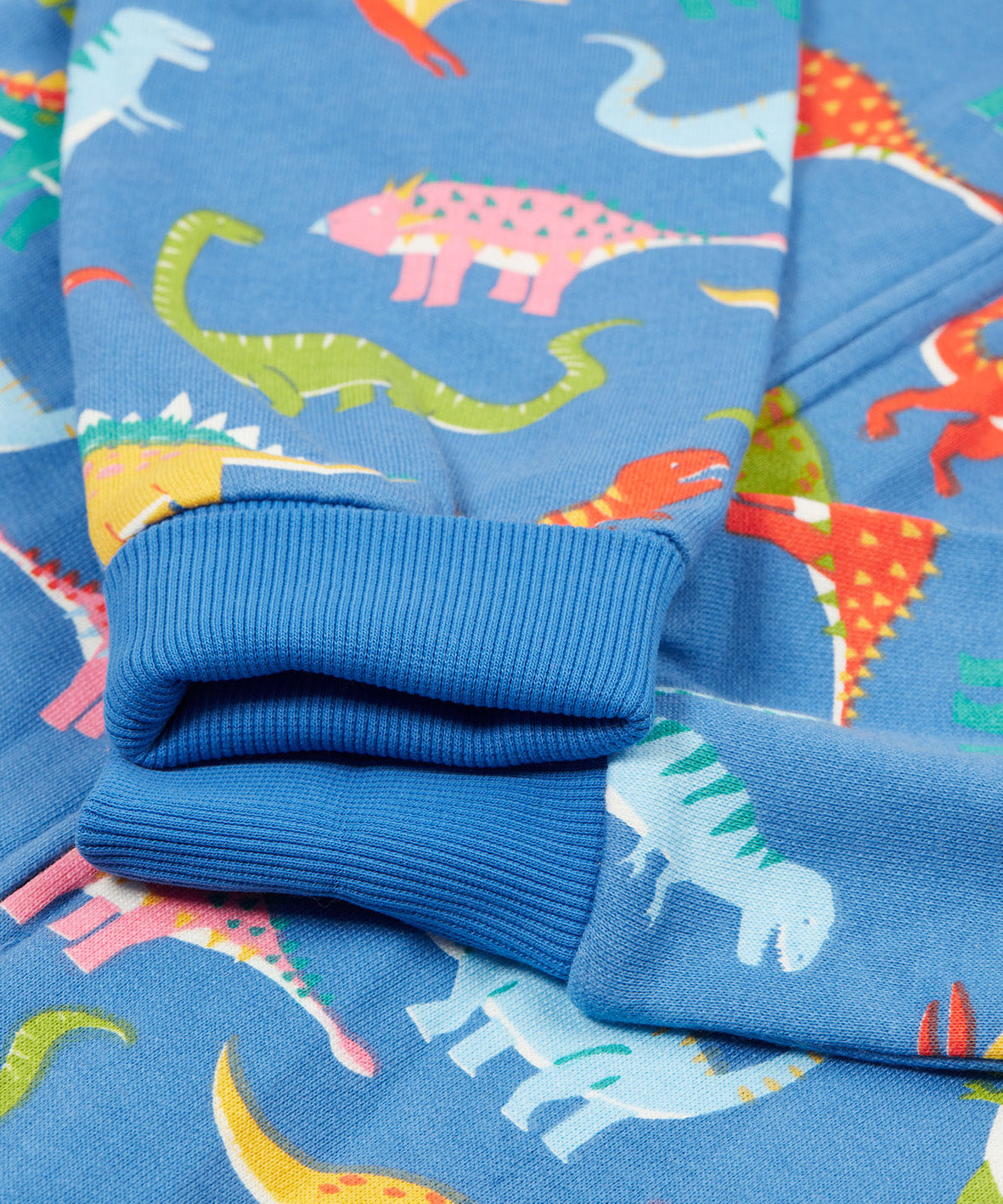 Frugi blue snuggle suit dino roar arm cuff detail