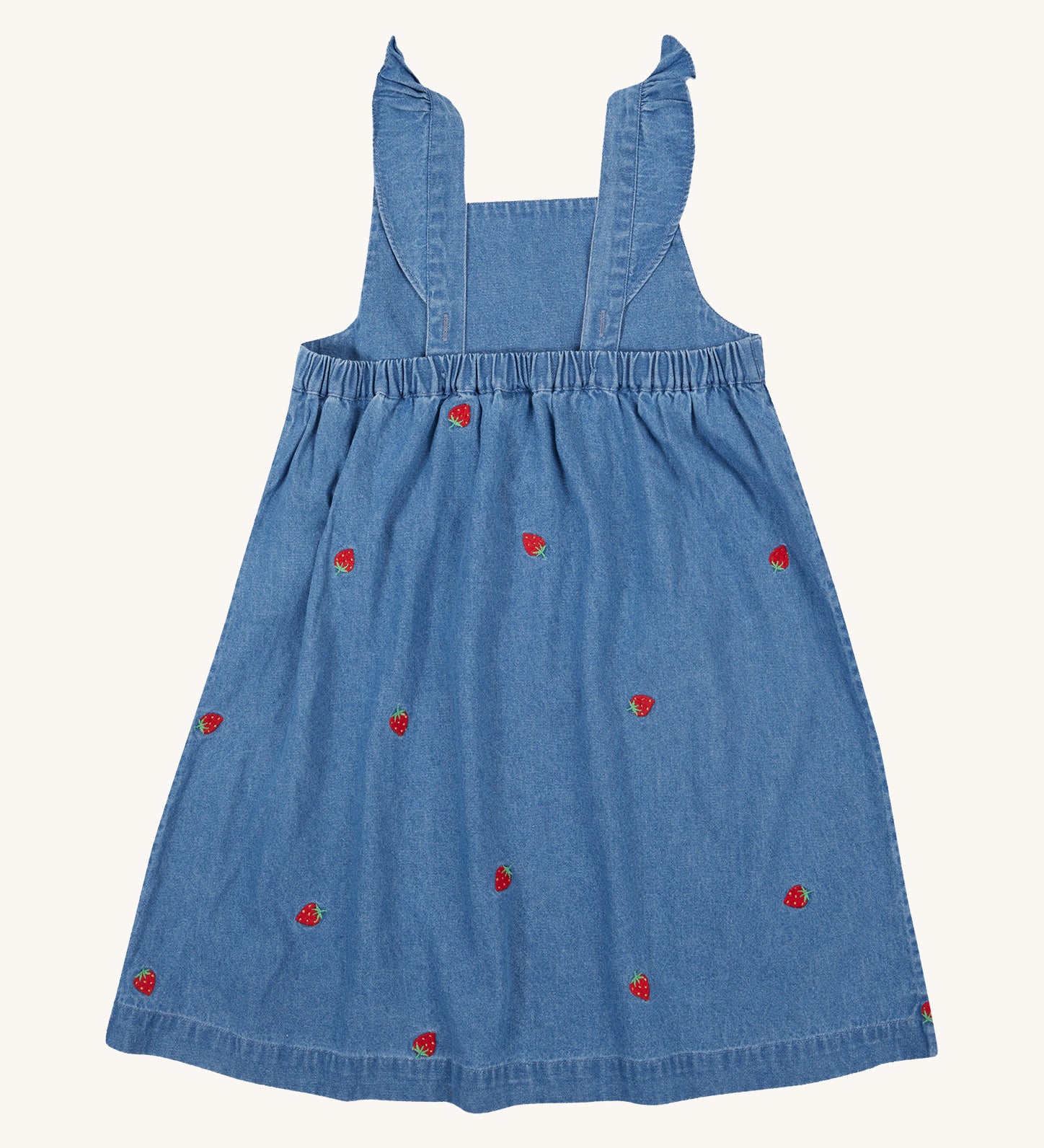 Frugi blue denim dress strawberry design back detail on a cream background.