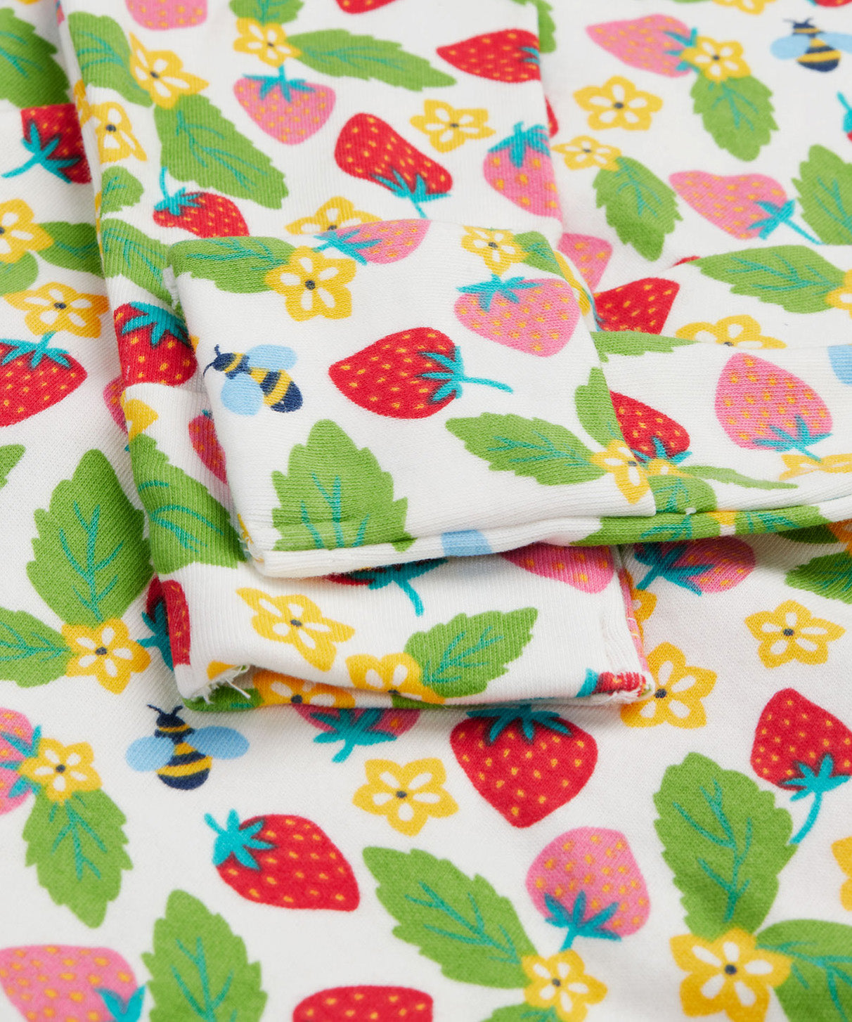 Frugi white dressing baby grow strawberry field cuff detail