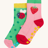 Frugi 2 pack grippy socks strawberry and ladybird design on a cream background