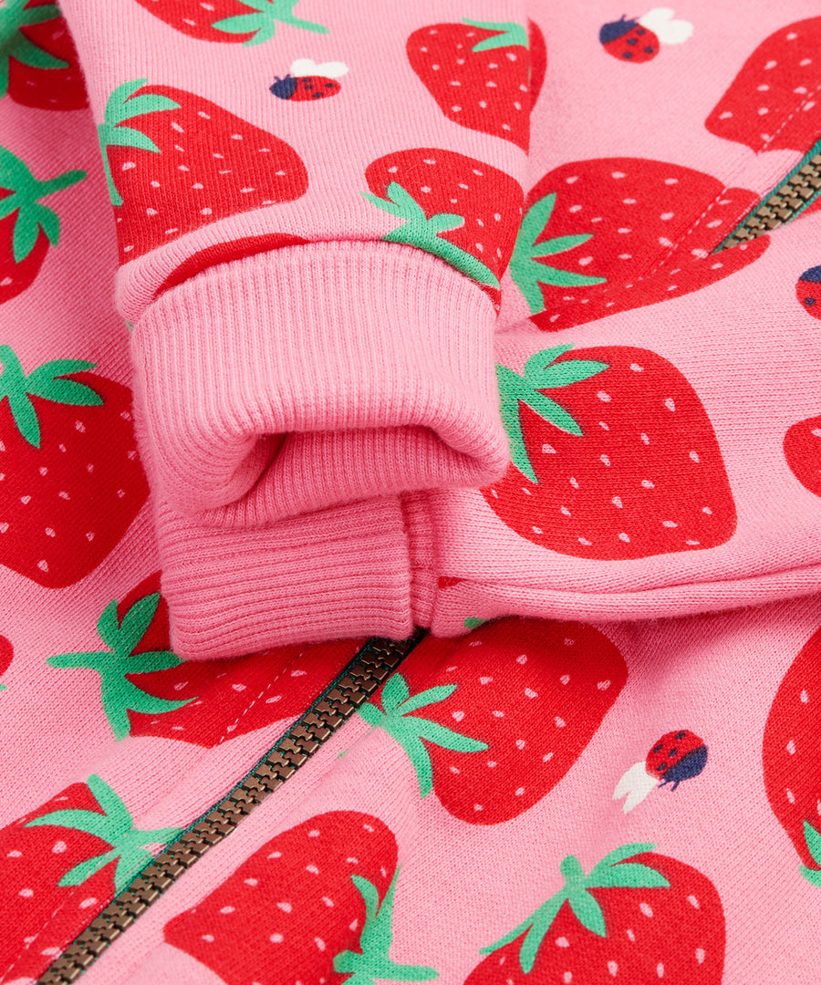 Frugi kids snuggle suit in strawberry design arm cuff detail