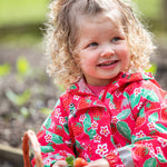 Frugi pink all in one suit strawberry pals design