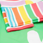 Frugi green and stripe sun safe suit daisy cuff detail