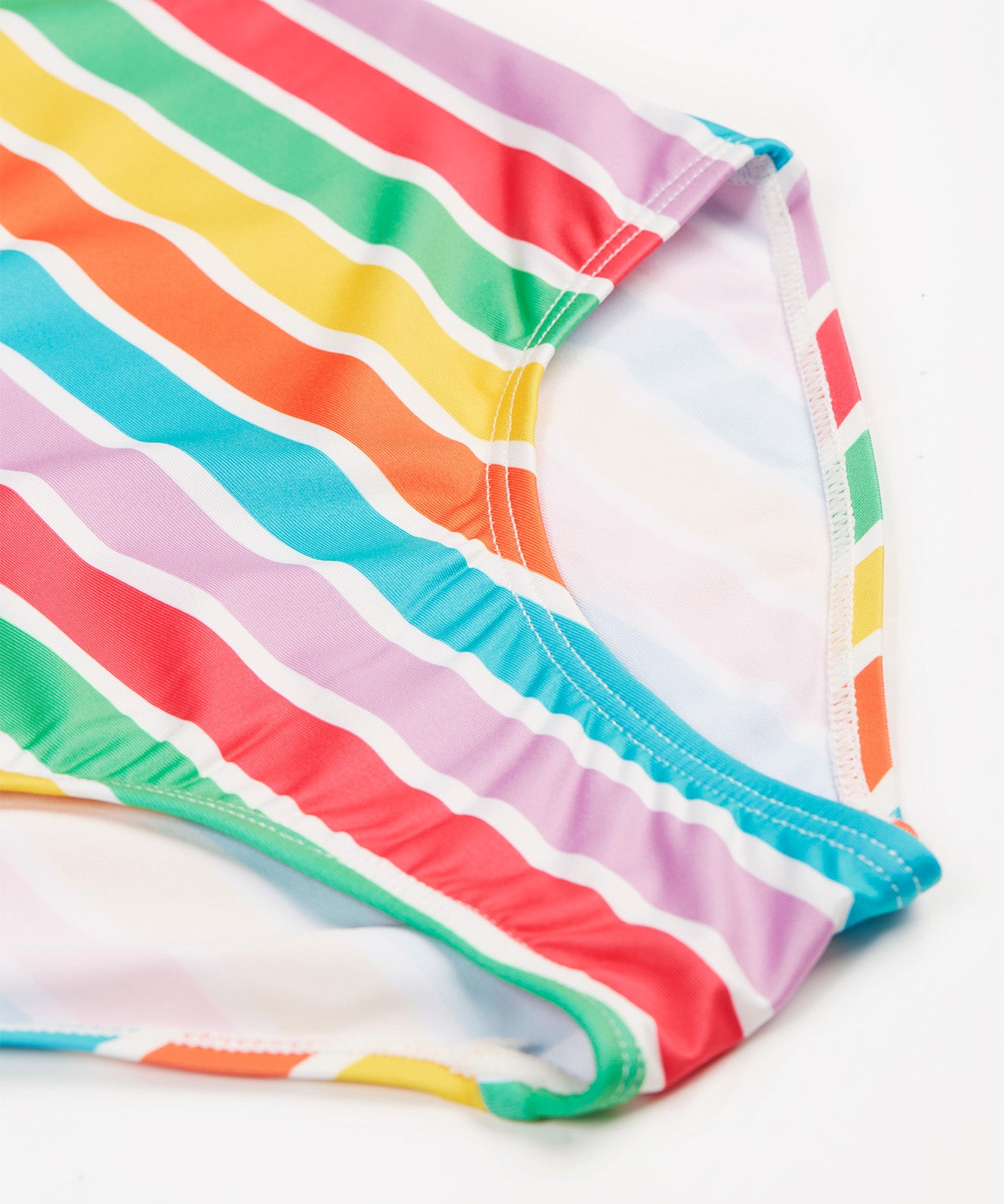 Frugi swim suit in a light multicoloured striped design front detail