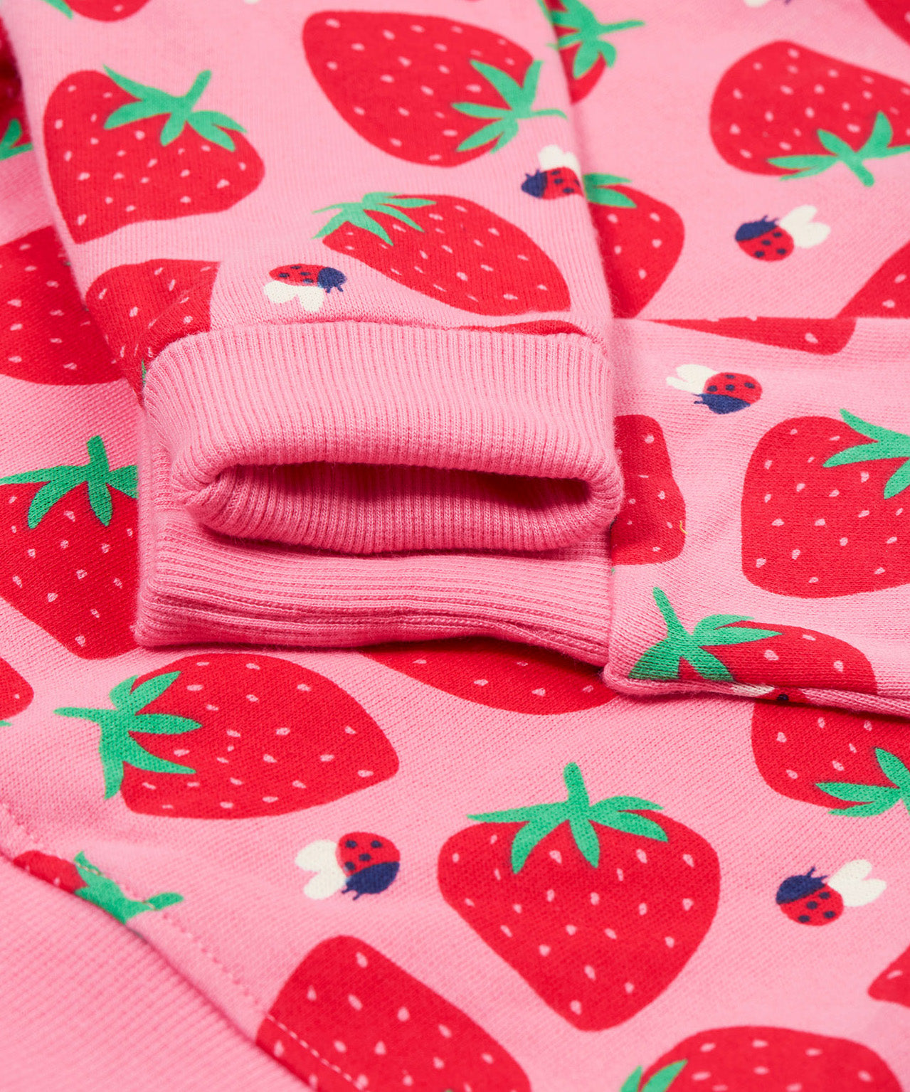 Frugi pink sweater strawberry pals cuff detail