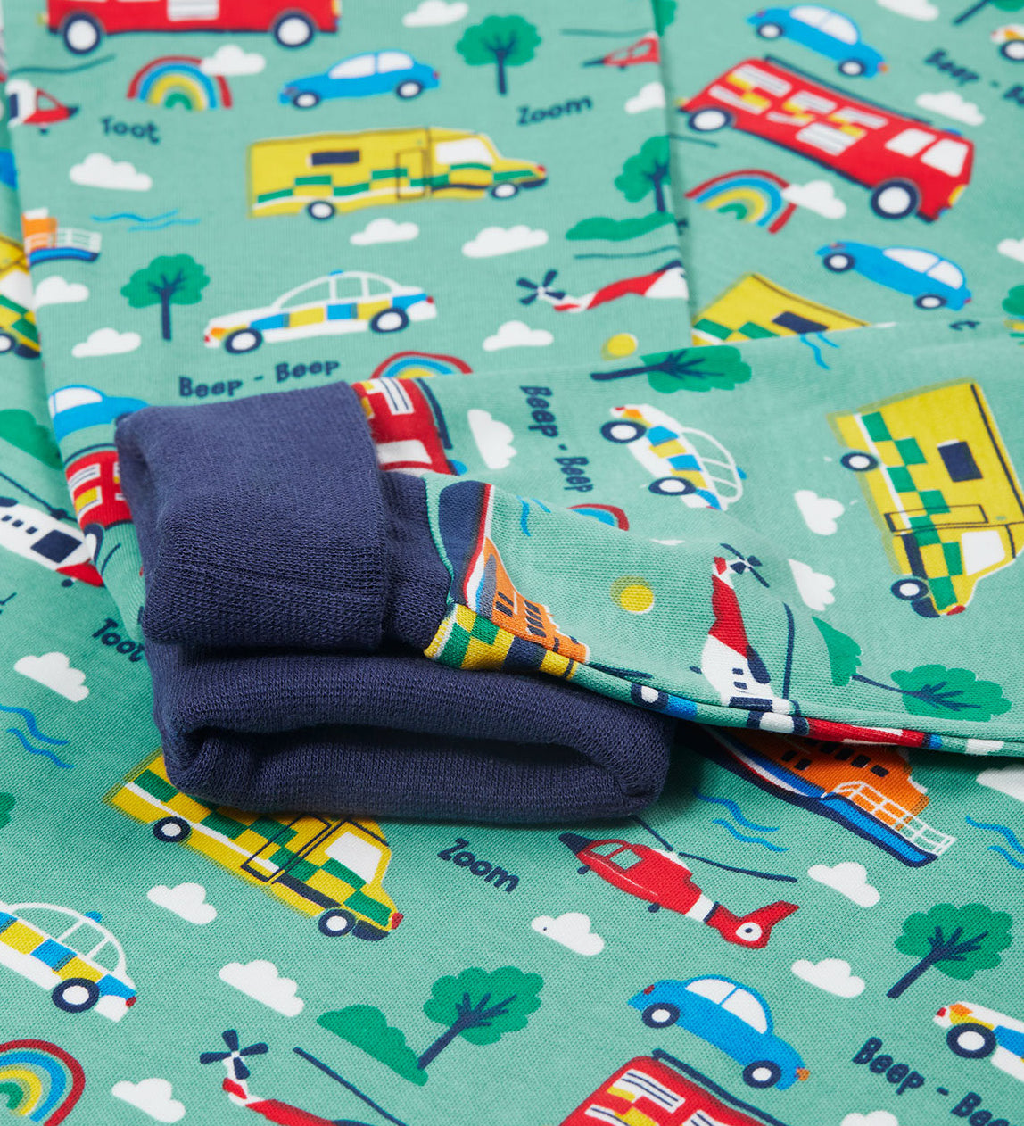 Frugi green pyjama set to the rescue top cuff detail