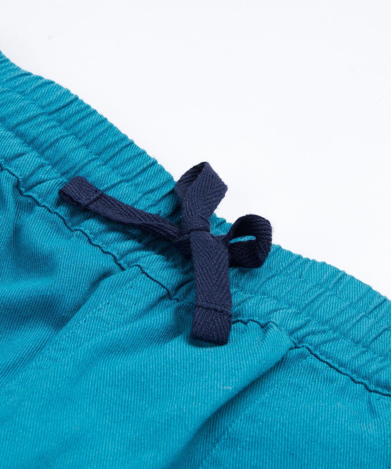 Frugi kids trousers in green, blue, turquoise colour waist and tie detail