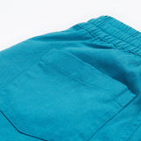 Frugi kids trousers in green, blue, turquoise colour back pocket detail