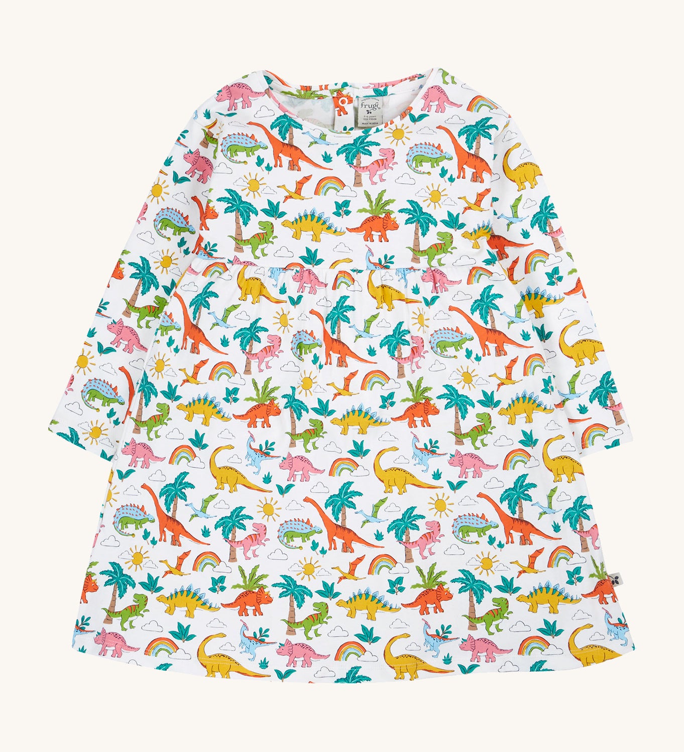 Frugi white dress dinoland design on a cream background.