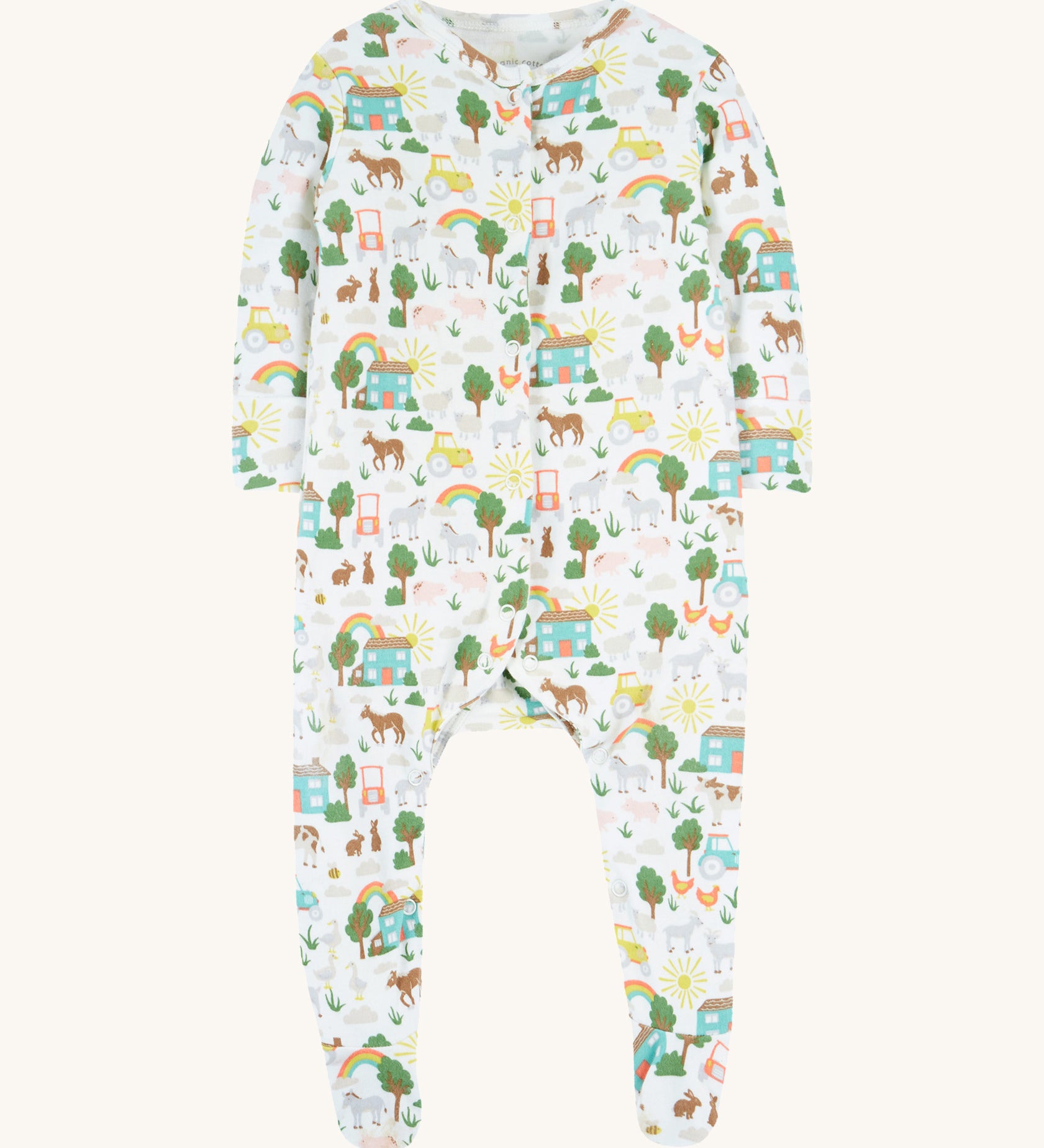 Frugi white baby grow farm life design on a cream background