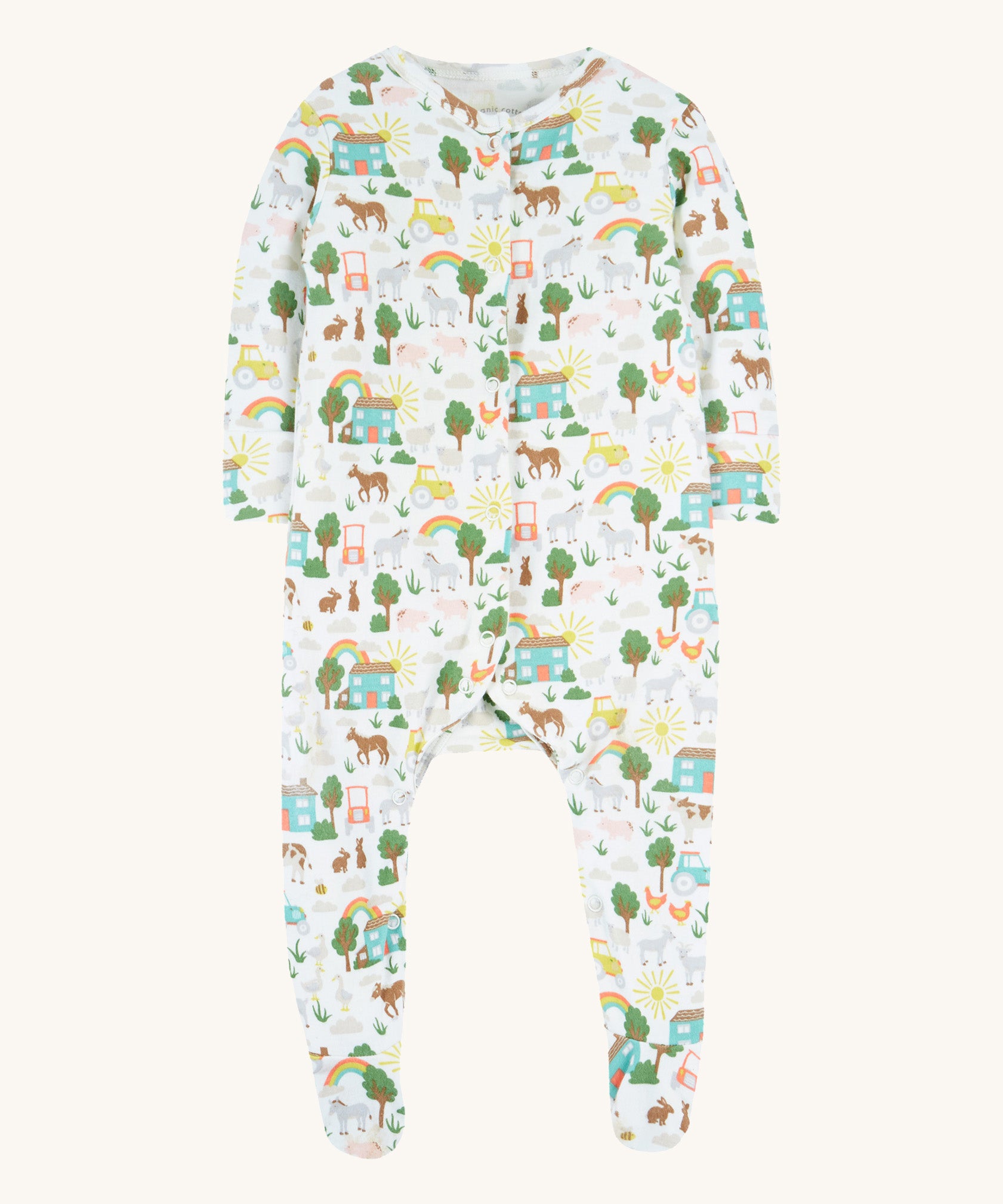 Frugi white baby grow farm life design on a cream background