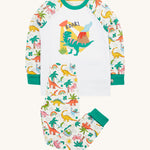 Frugi white pyjama set dinoland design on a cream background.