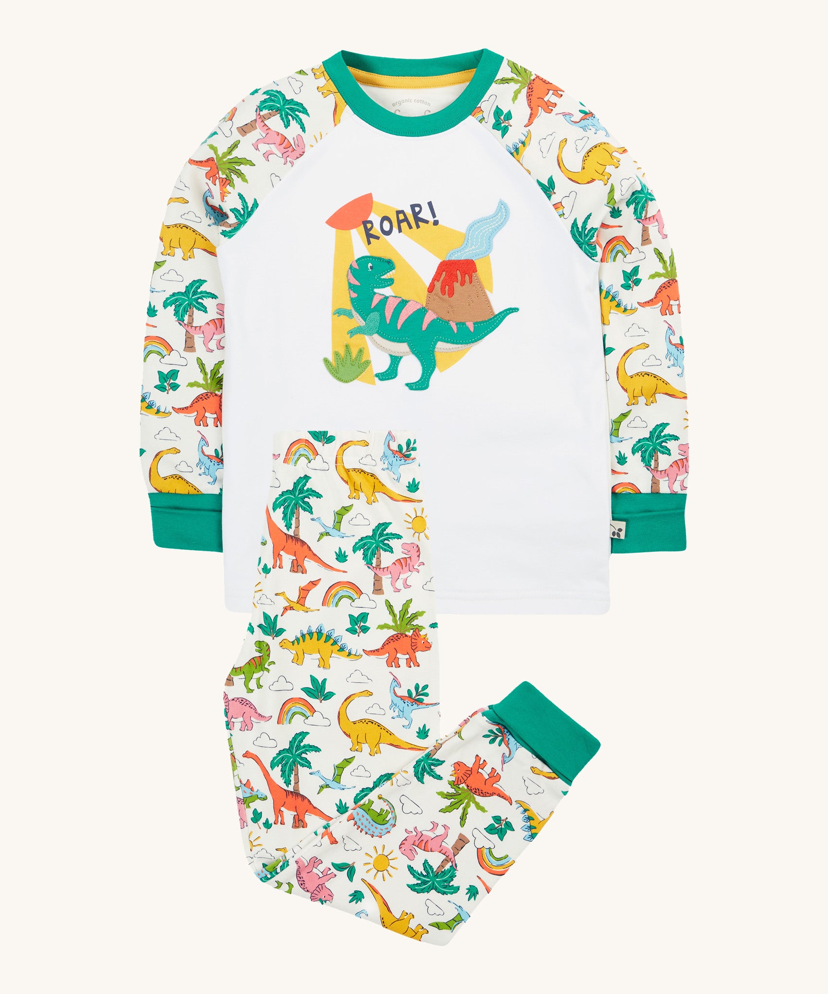 Frugi white pyjama set dinoland design on a cream background.