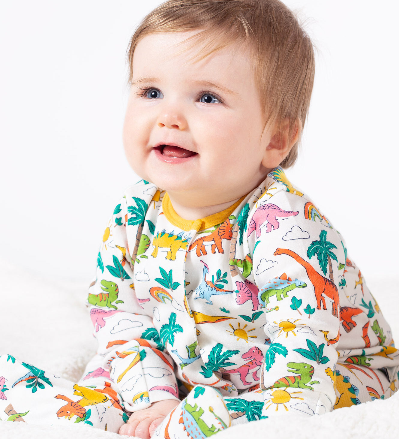 Frugi white baby grow dino land design