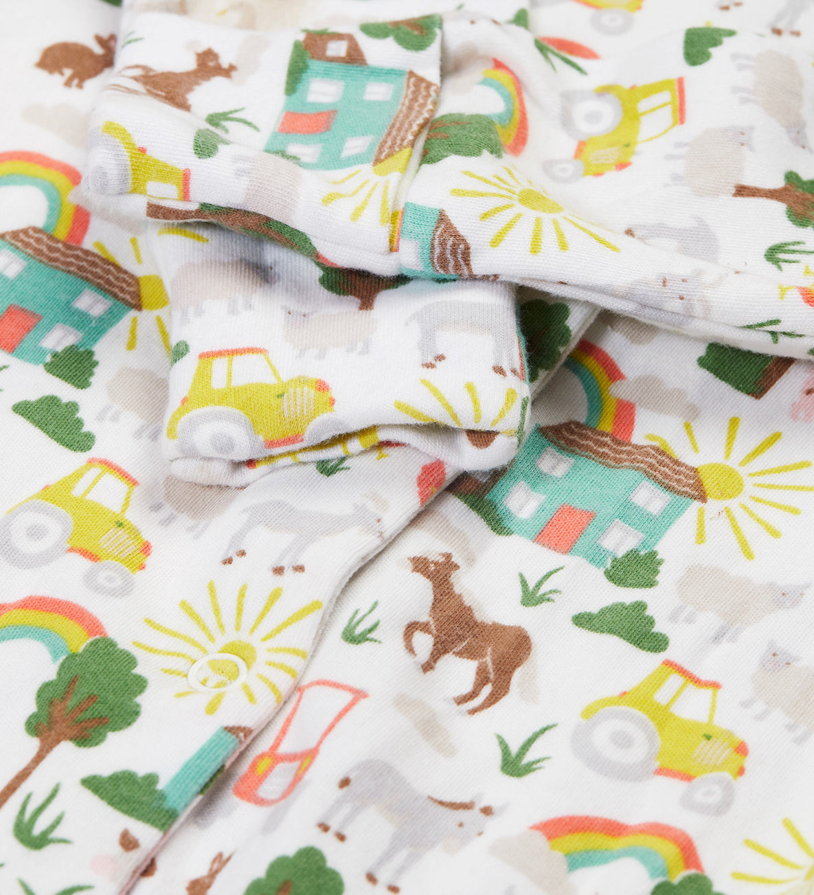 Frugi white baby grow farm life cuff detail