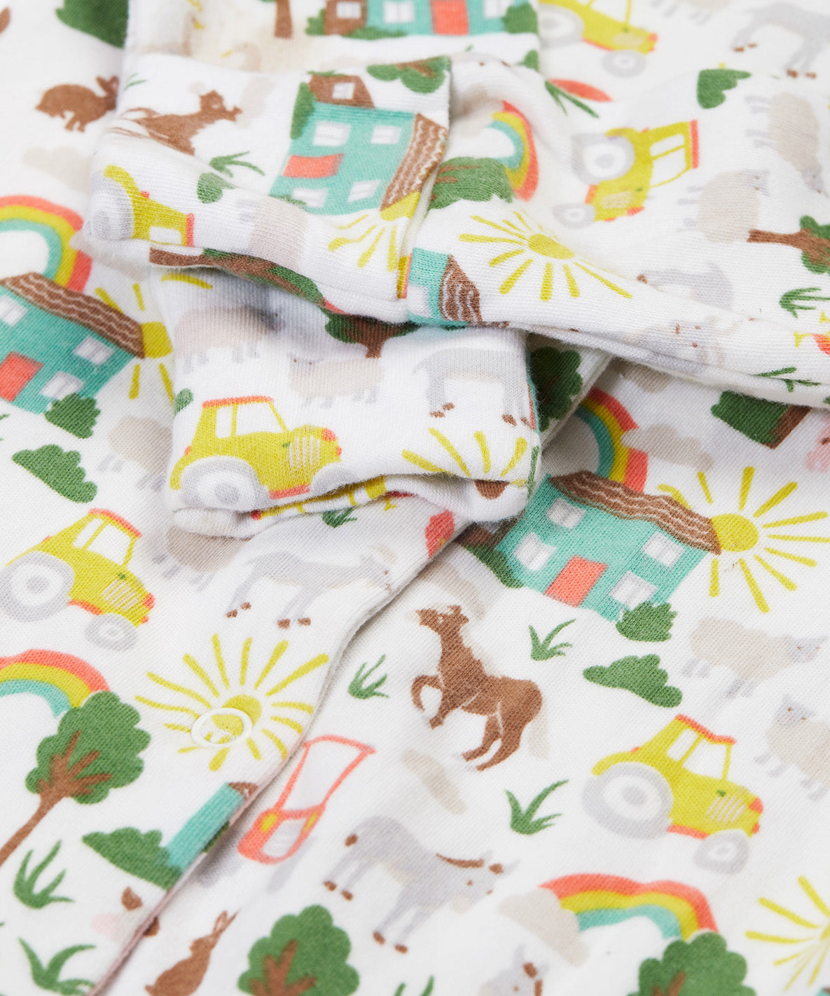 Frugi white baby grow farm life cuff detail