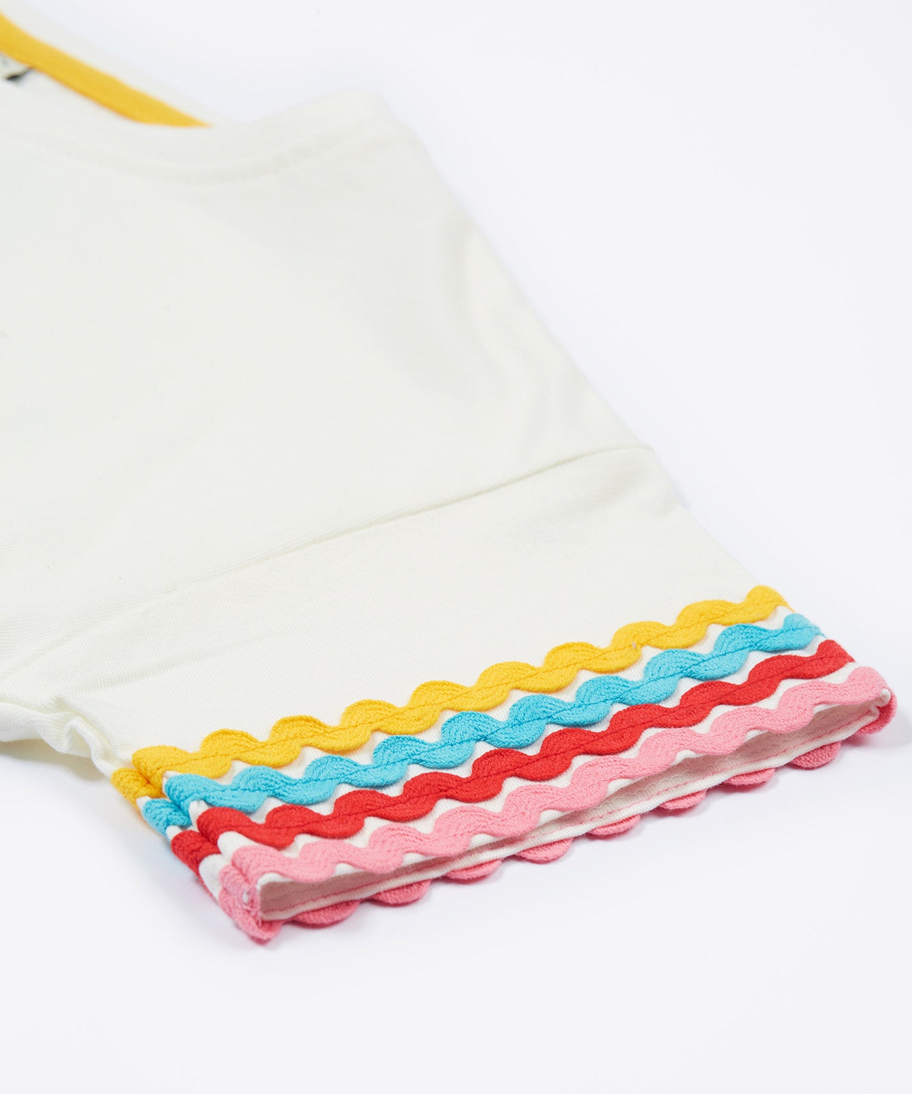 Frugi kids white short sleeve t-shirt with a rainbow trim on the sleeve, sleeve detail