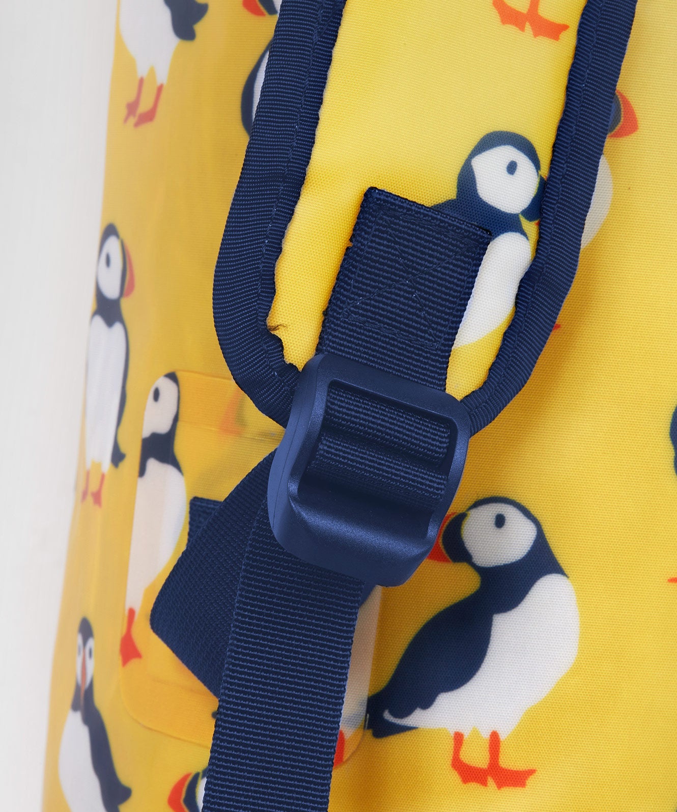 Frugi yellow dry bag puffin design back strap detail