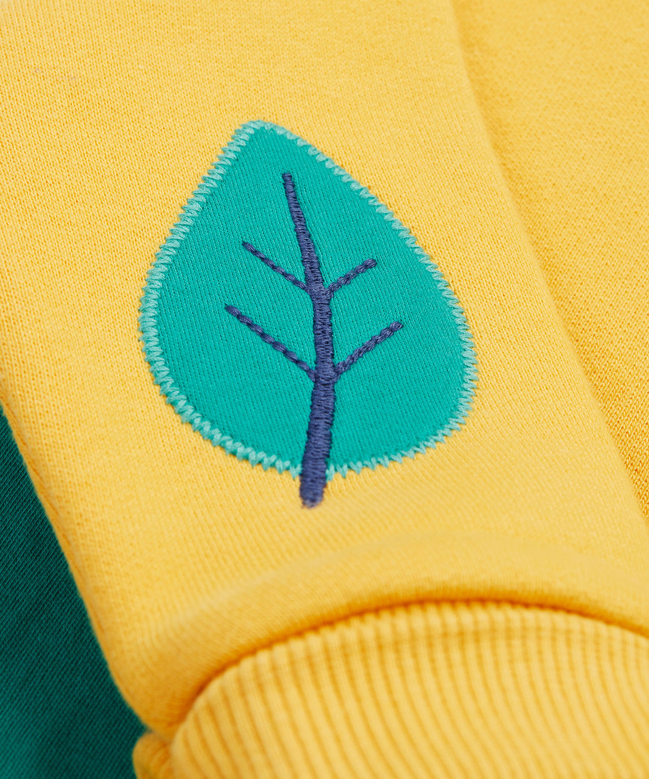 Frugi yellow easy on jumper dino leaf detail