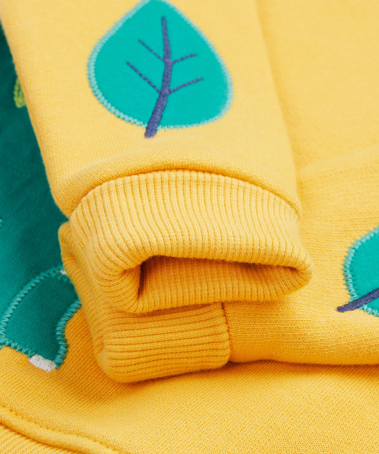 Frugi yellow easy on jumper dino cuff detail