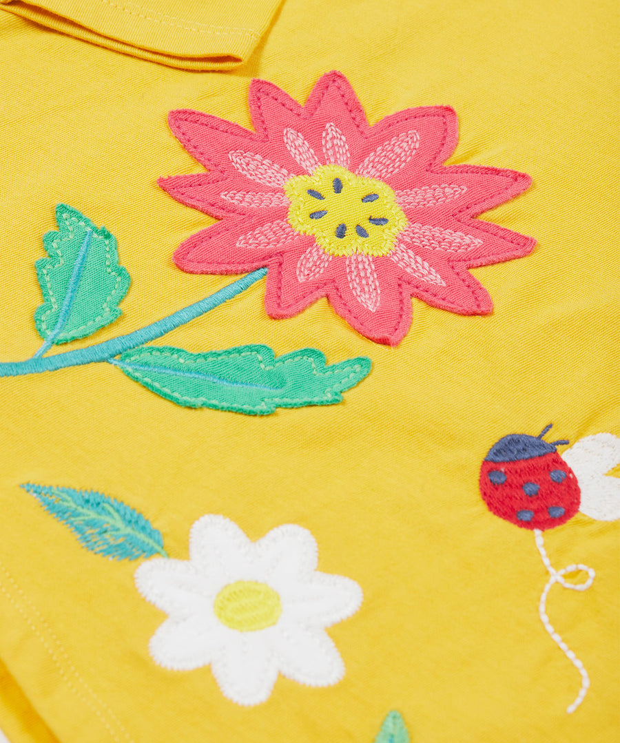 Frugi yellow long sleeve top flowers print detail.