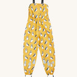 Frugi yellow puddle buster trousers puffin design on a cream background.