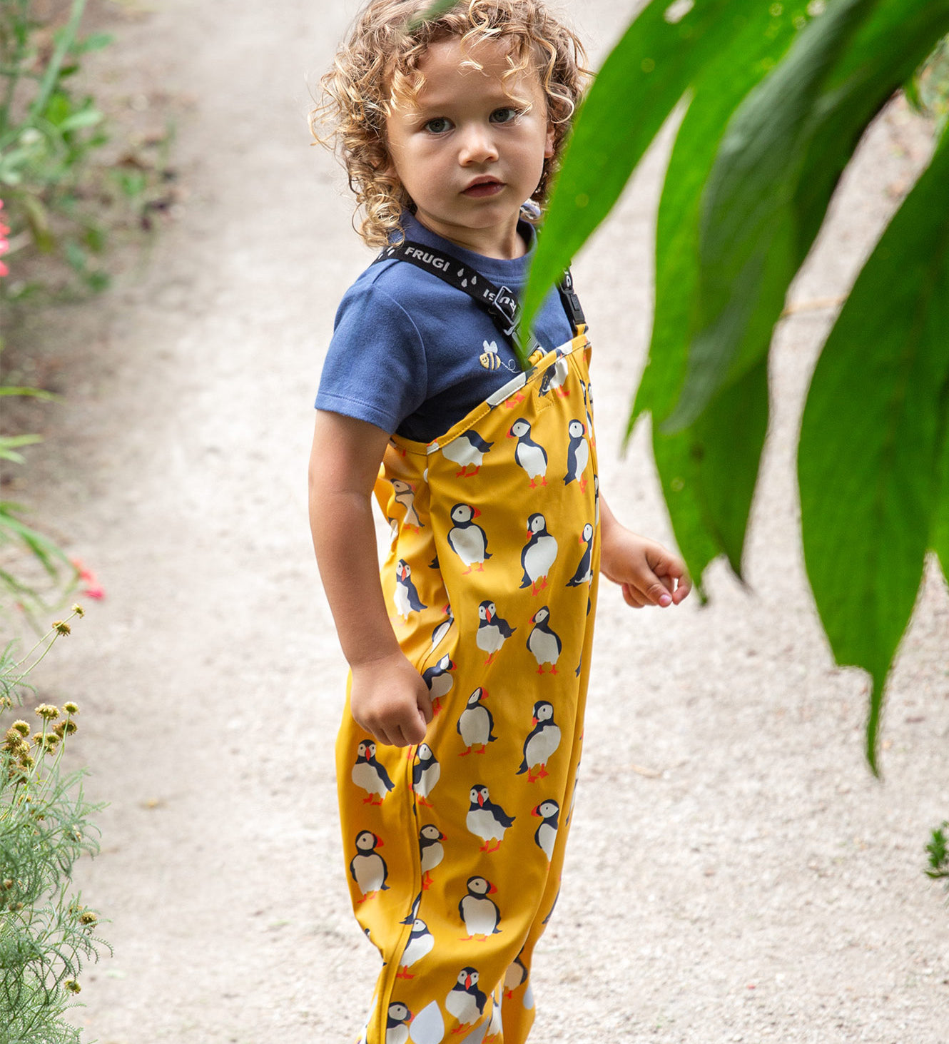 Frugi yellow puddle buster trousers puffin design