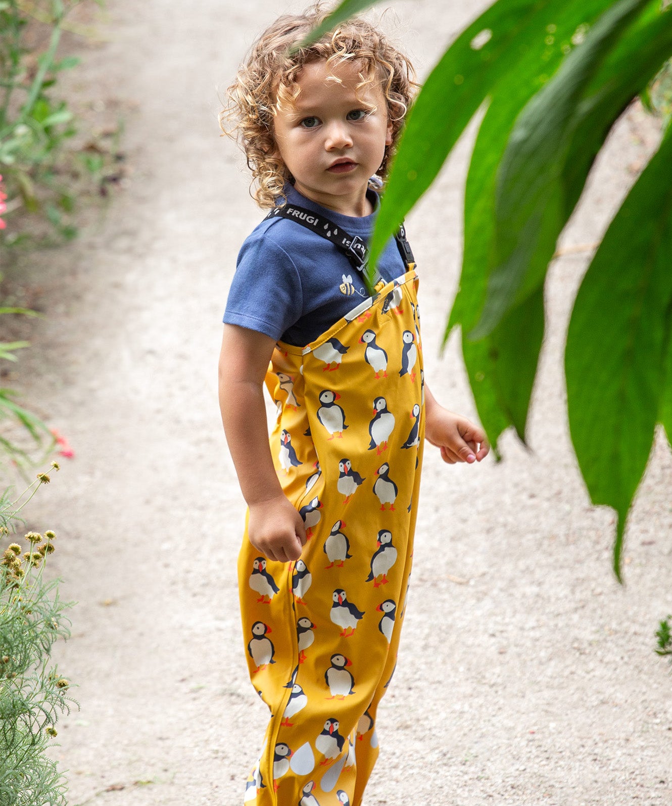 Frugi yellow puddle buster trousers puffin design