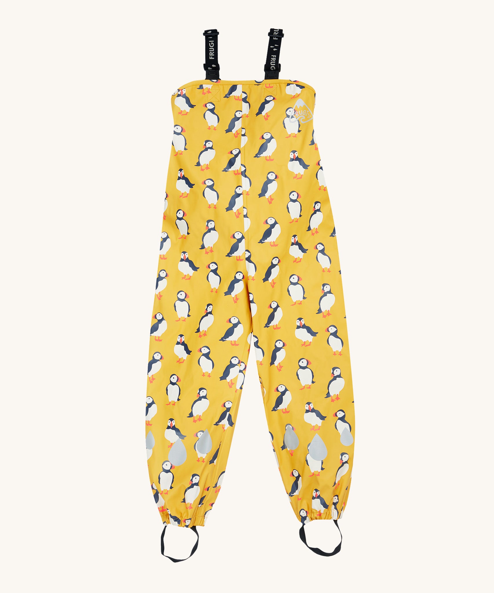 Frugi yellow puddle buster trousers puffin design on a cream background.