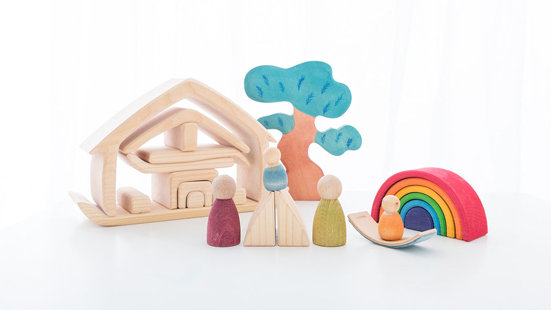 Gluckskafer wooden house with some Grimm's peg dolls, a Bumbu tree, and a mini rainbow