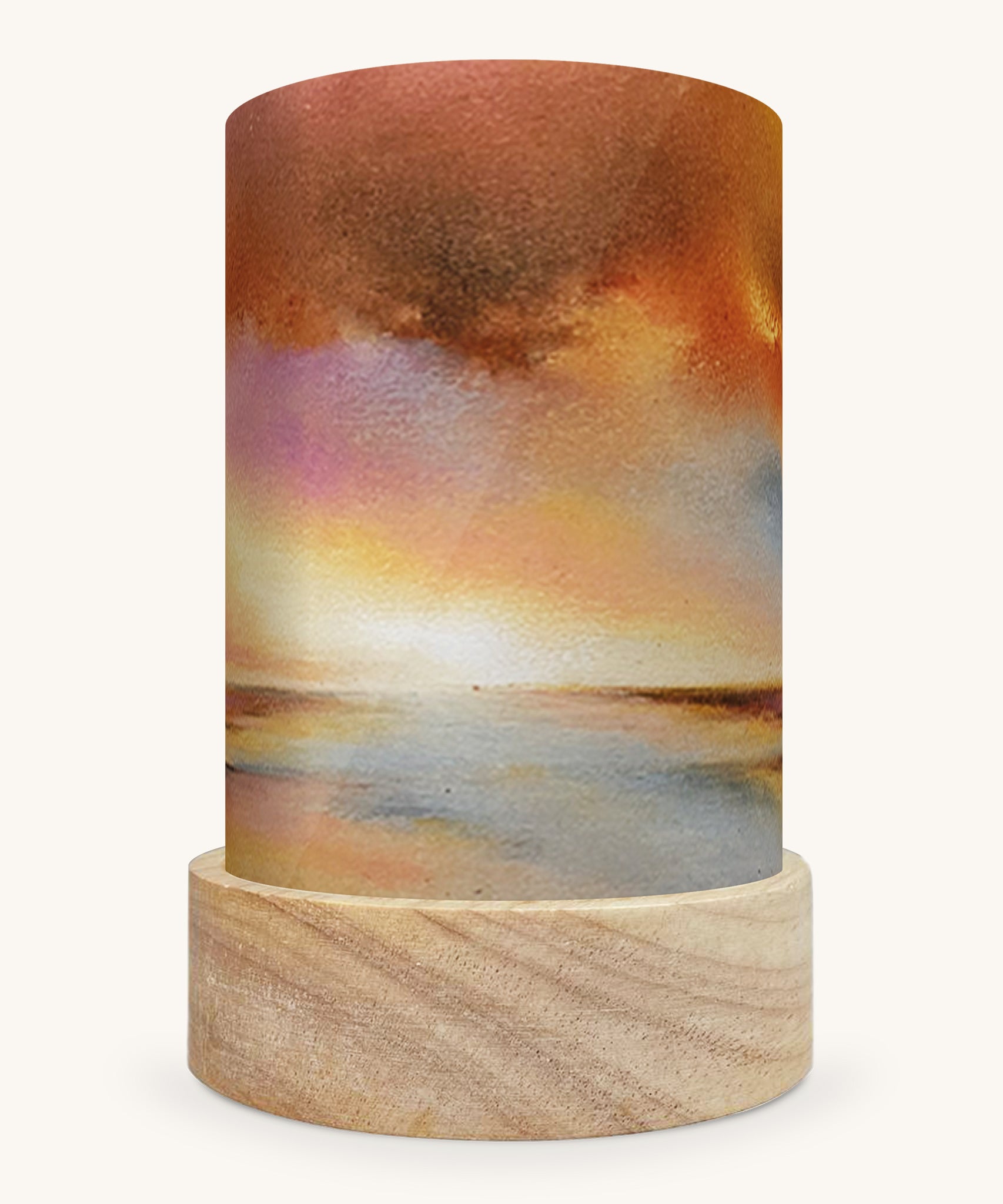 The Golden Sunset illustration by Baukje Exler sat in a Toverlux Magic Lantern base, on a cream background