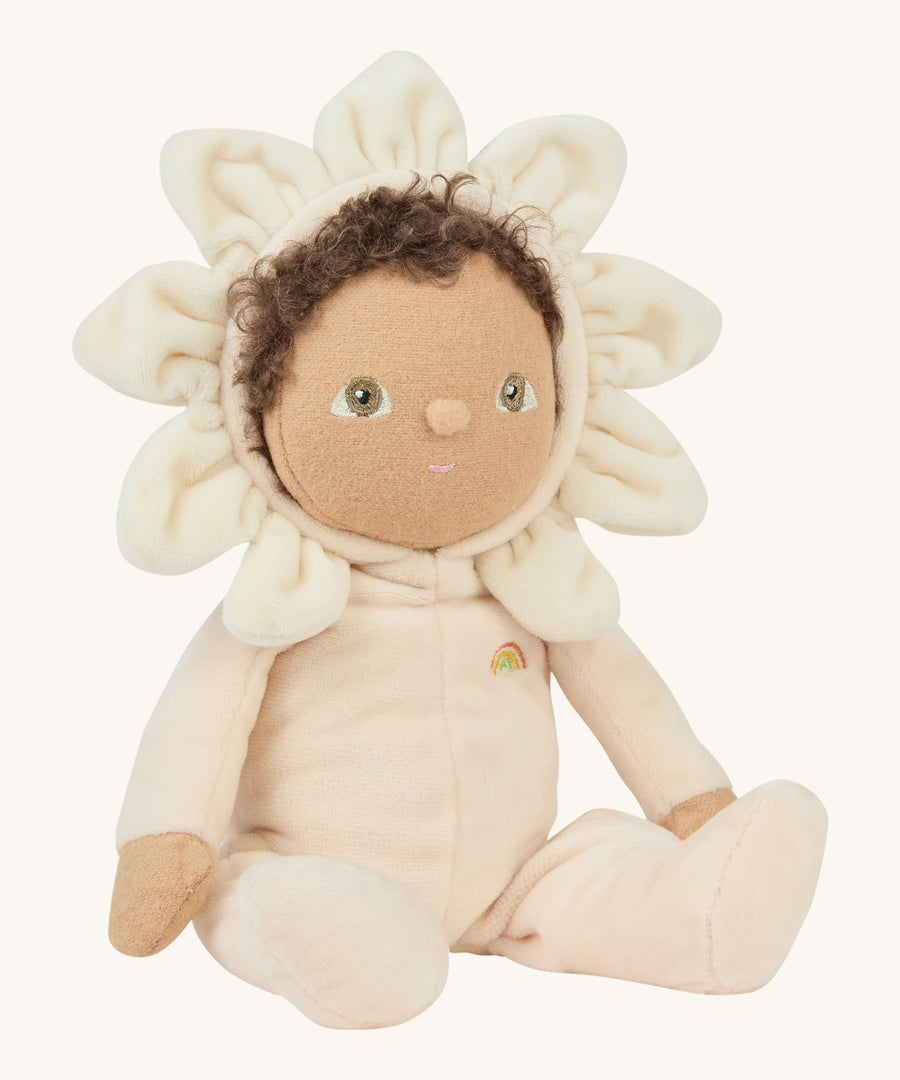 A side photo of the light cream dinky dinkum doll on a cream background.