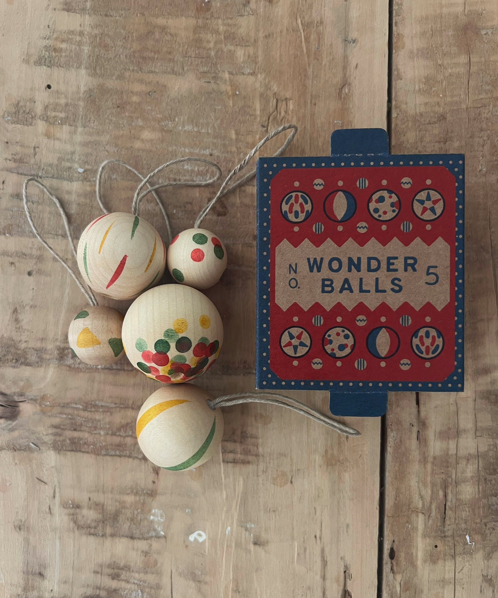 Grapat Wooden Christmas Ornaments - Wonder Balls. Beautifully hand made, and hand painted Christmas ornaments, with an heirloom quality to be used year after year. Snow Buddy consists of 5 snowball like ornaments, in various sizes and painted a spots or a stripe design with bright colours.