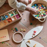 Grapat wooden bloom mis and match wooden block set on wooden Grapat petals and a basket on the floor