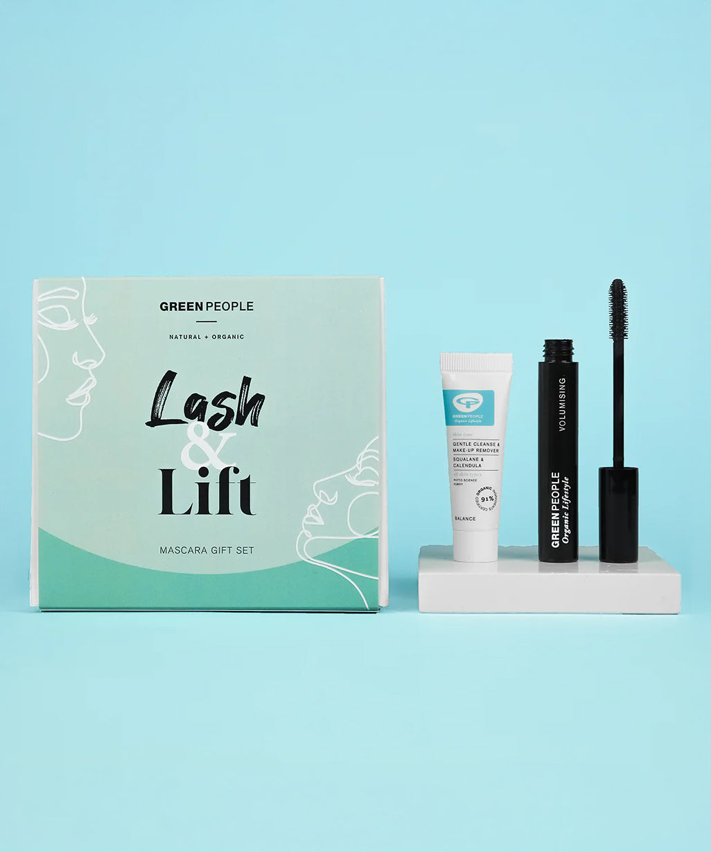 The Green People Lash & Lift Mascara Gift Set Box, with the Green  People Cleanser and Mascara next to it on a white shiny block