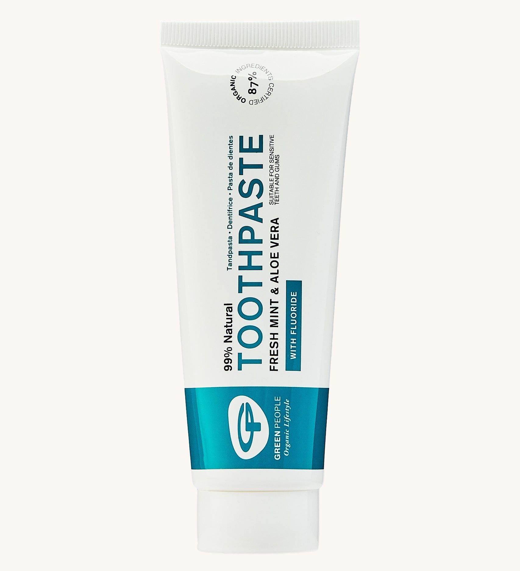 Green People Fresh Mint & Aloe Vera Toothpaste with Fluoride. Comes in a white and blue fully recyclable tube. The image is on a green background