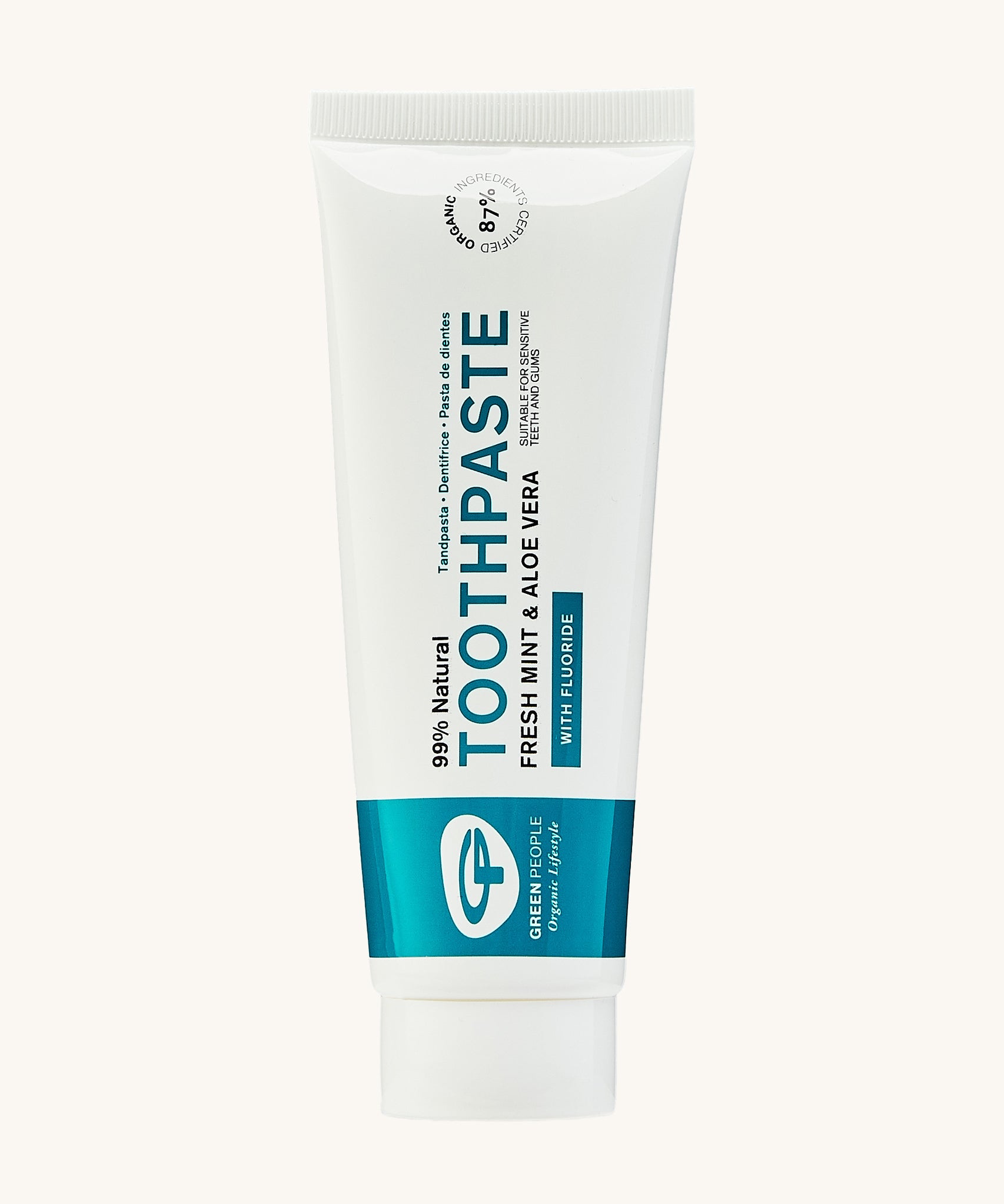 Green People Fresh Mint & Aloe Vera Toothpaste with Fluoride. Comes in a white and blue fully recyclable tube. The image is on a green background