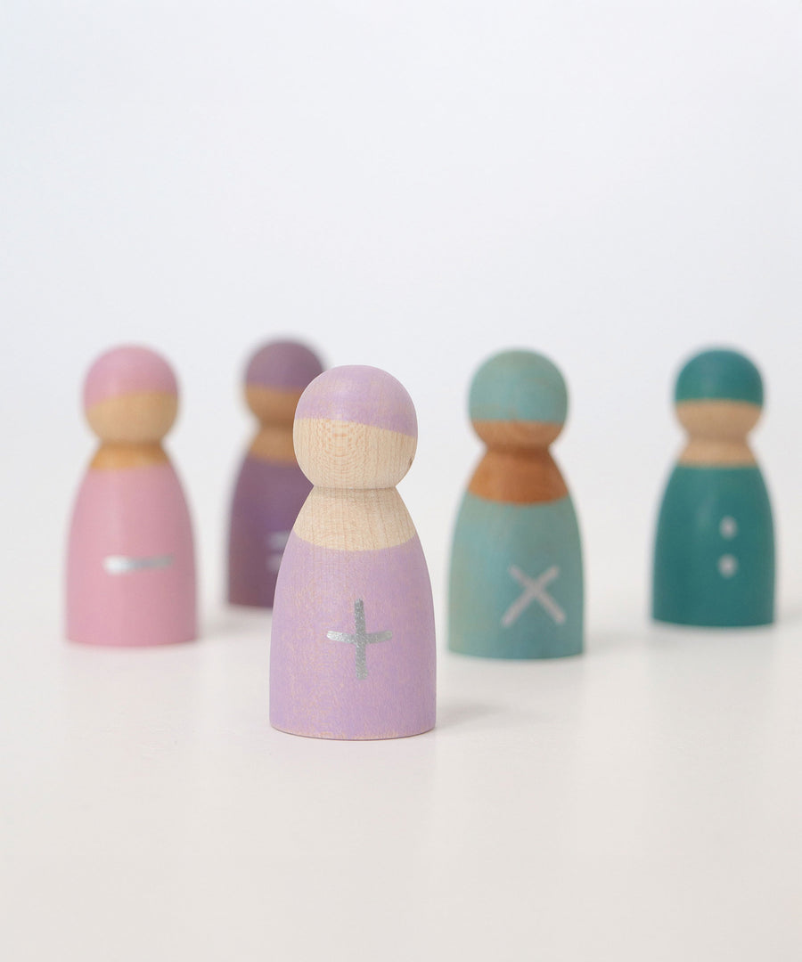 A closer look at the pastel purple addition wooden peg doll from the Grimm's 5 Maths Friends, with a silver plus sign hand painted on the front