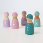 A closer look at the turquoise divide wooden peg doll from the Grimm's 5 Maths Friends, with two silver hand painted dots 