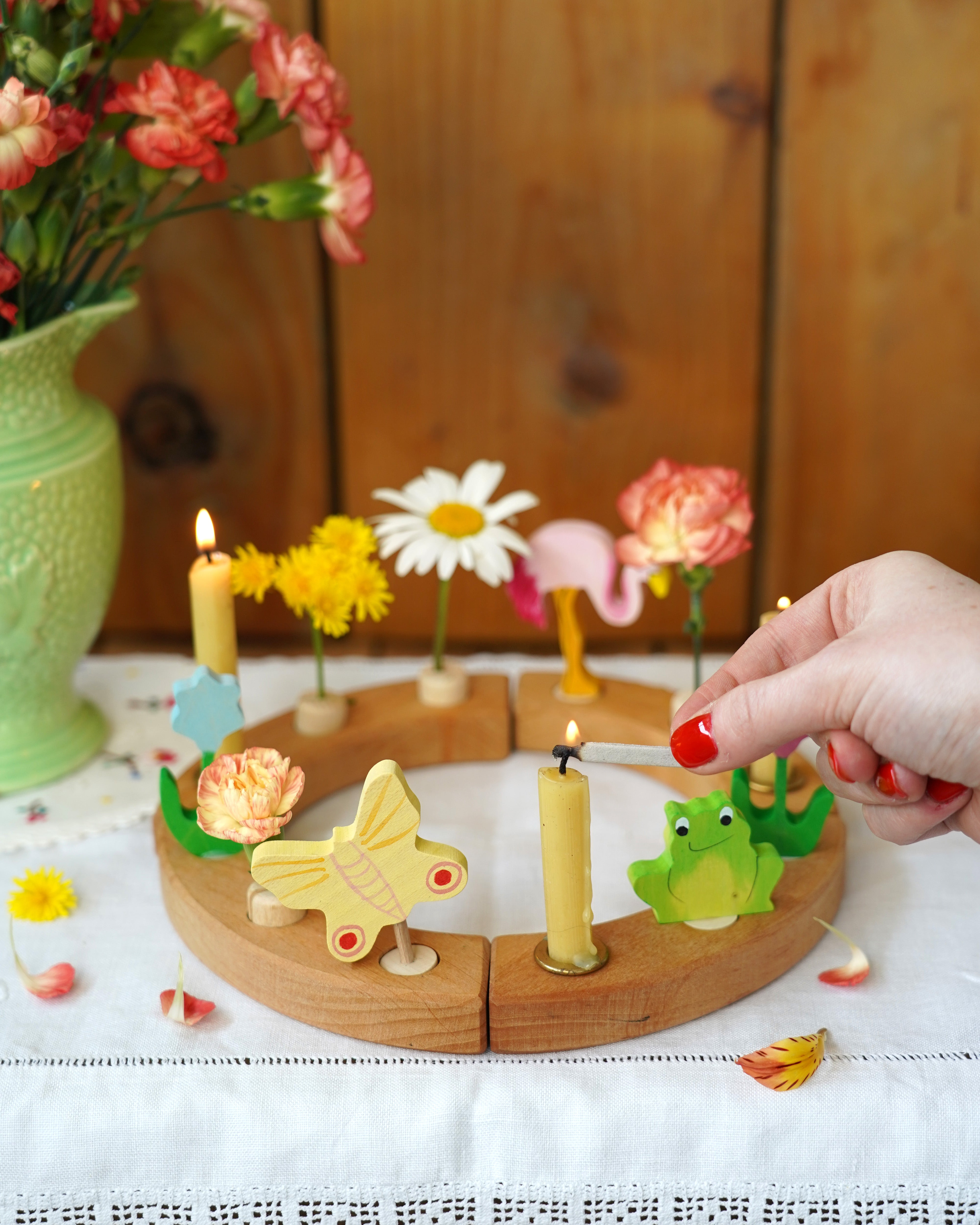 A beautiful sprint time display using a Grimm's Waldorf Celebration Ring, Grimm's decorative figures and Grimm's Candles